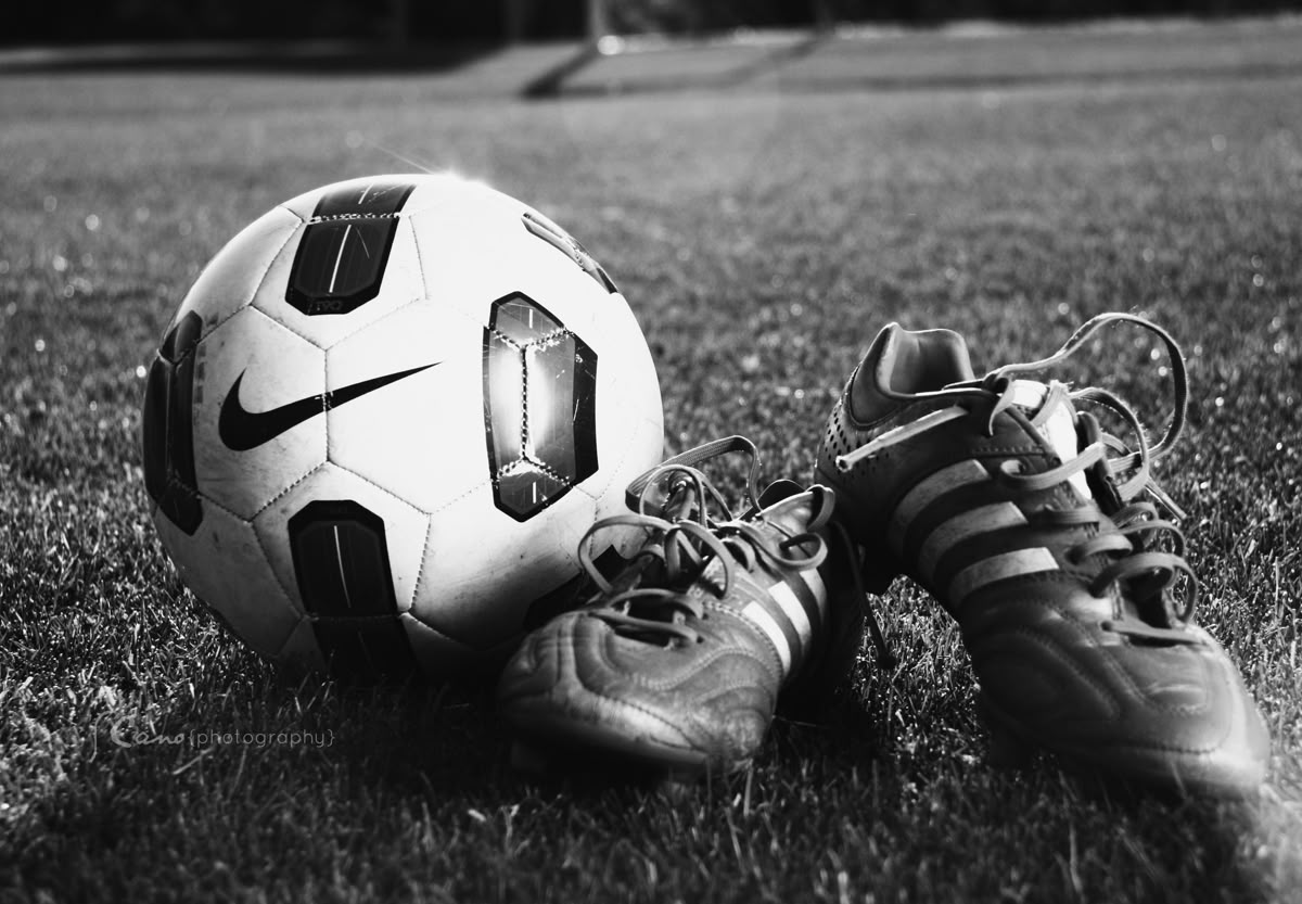 Football boots and ball
